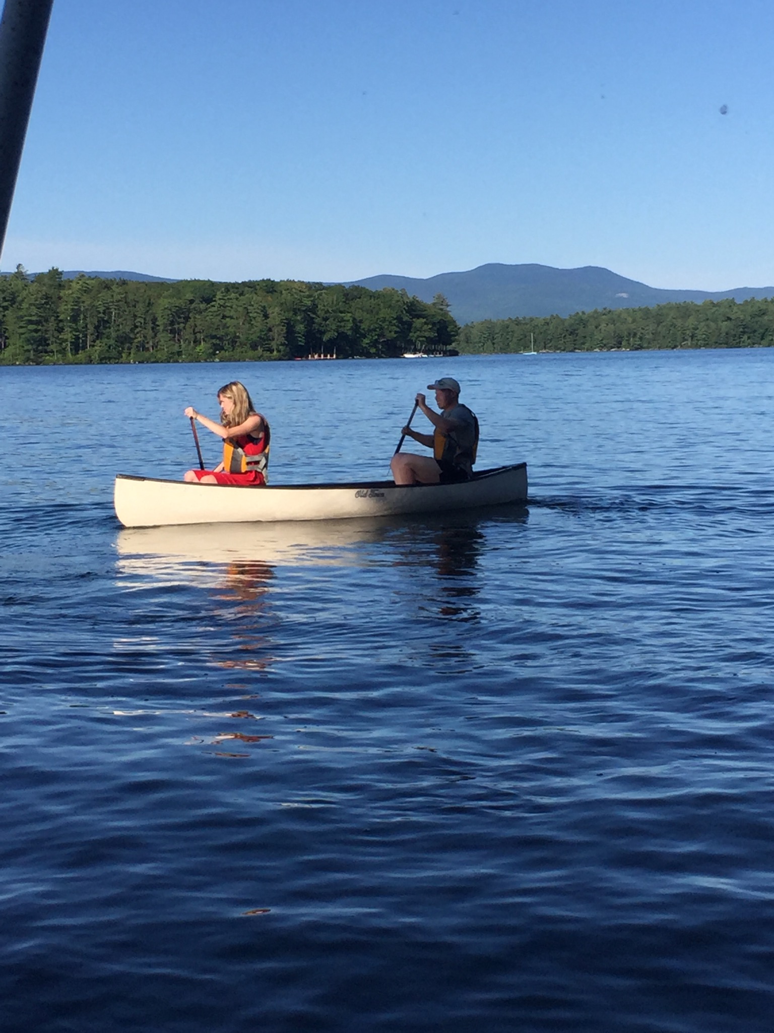 canoeing by 144 Veasey Shore Road's Winnipesaukee Shoreline in a Winni Lifestyle Video.