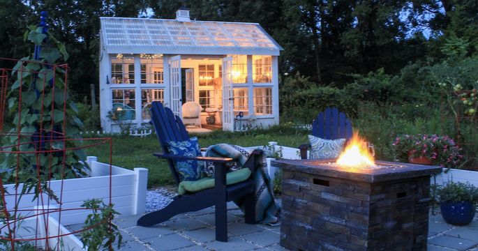 Patio with fire pit and shed