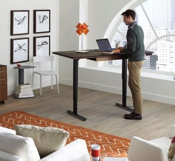 man using Standing desks for work