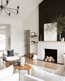 Living room with fireplace and chandelier