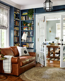 sofa french doors and bookshelves