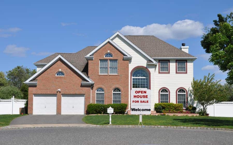 Two-Story Suburban Home With Open House For Sale Welcome Sign Out Front