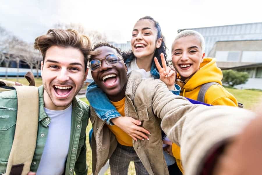 Students posing for picture on college campus
