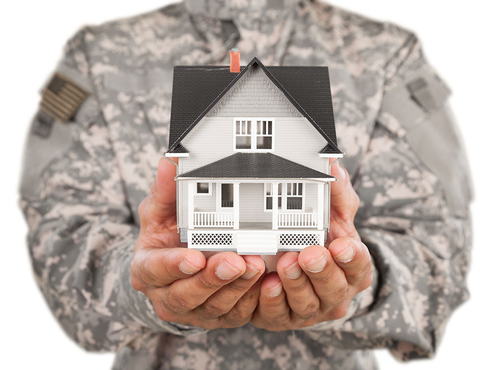 Veteran Holding Home in Hands