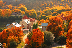 An aerial view of the town of Grantham, NH during peak foliage season.