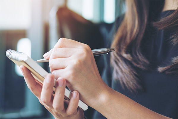 Woman Taking Notes