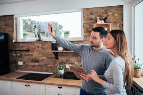 Couple Deciding to Renovate or Sell Home