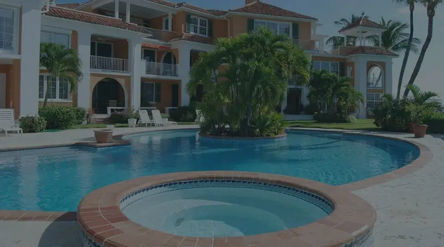 luxury home backyard with hot tub and pool in Bahamas