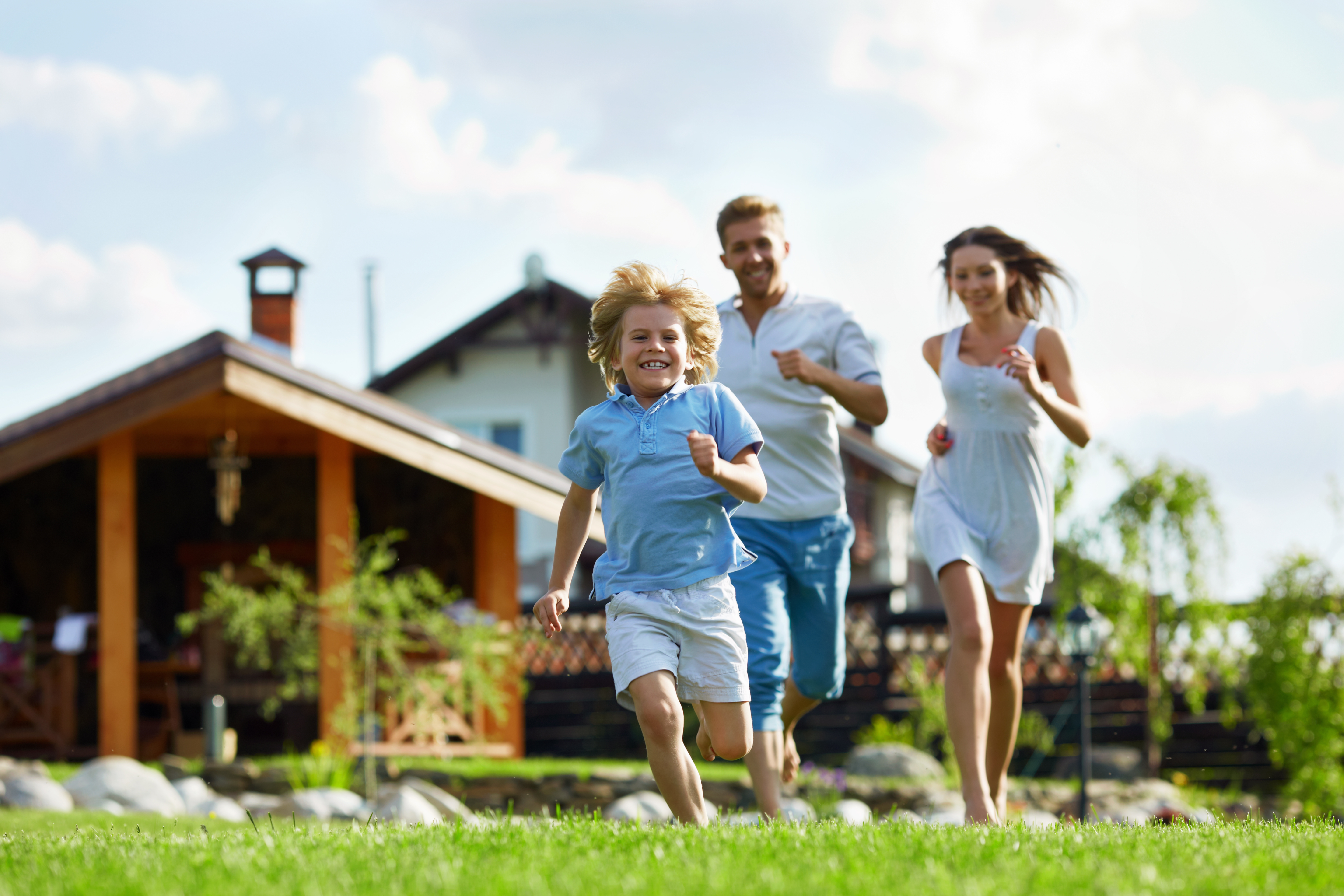 Family in front of beach property