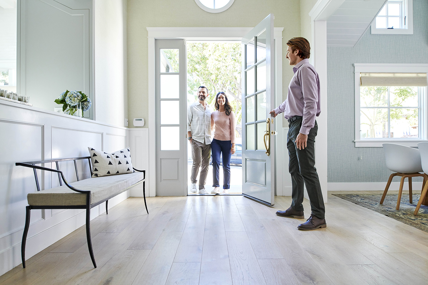 Real Estate Agent Showing A Couple A Home