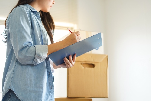 Woman Using a Move In Checklist