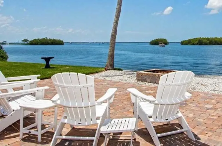 chairs on outdoor patio on the water