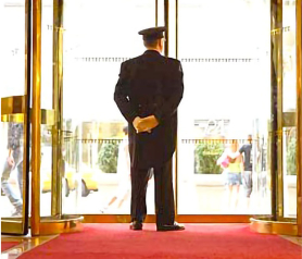 doorman in front of a door