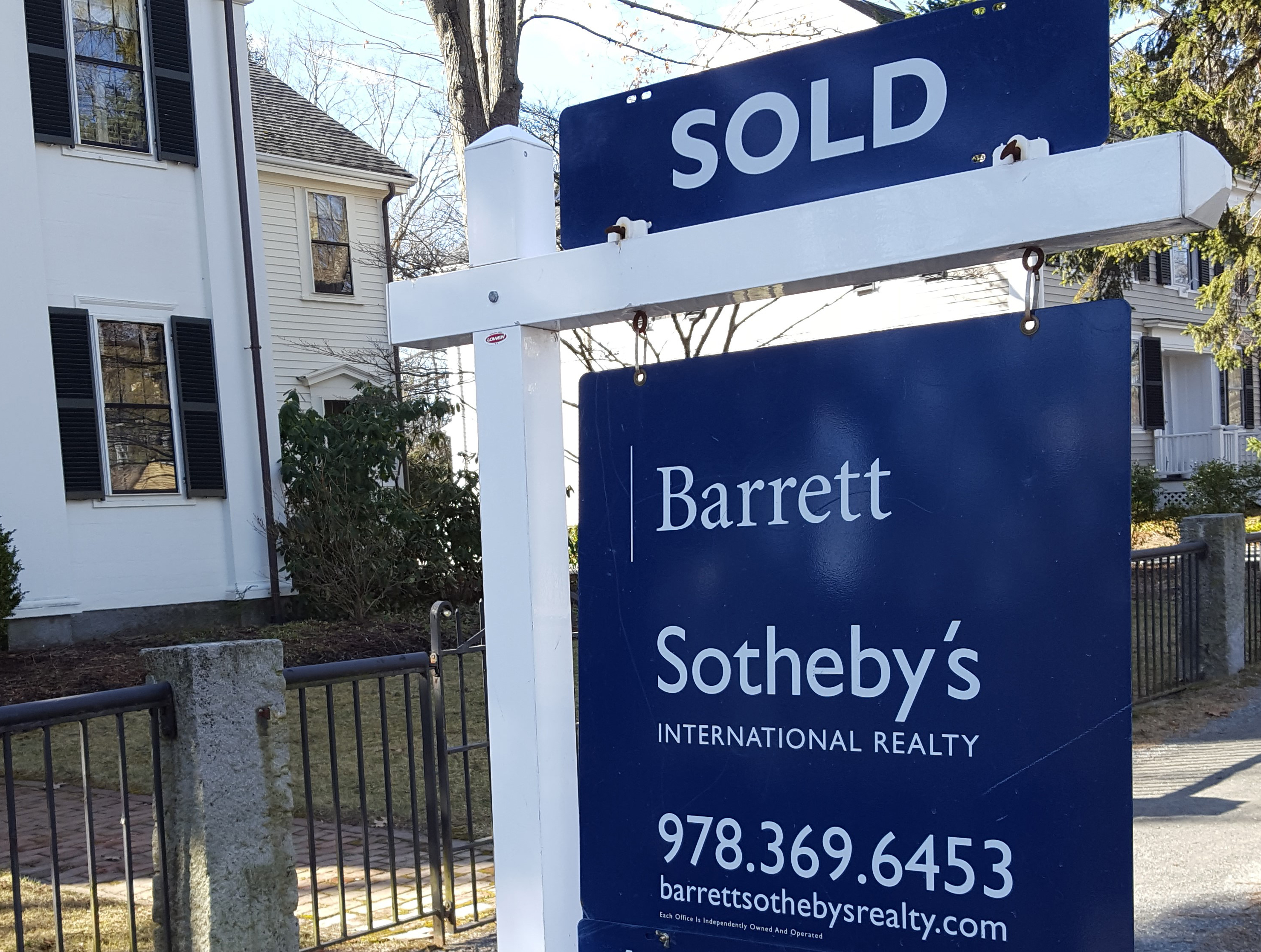 Barrett Sotheby's Sold Sign in Front of House