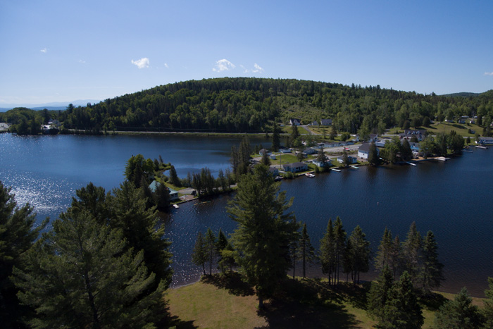 Sunset over mountains with field in the foreground