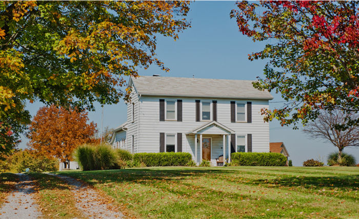 White house with fall folliage