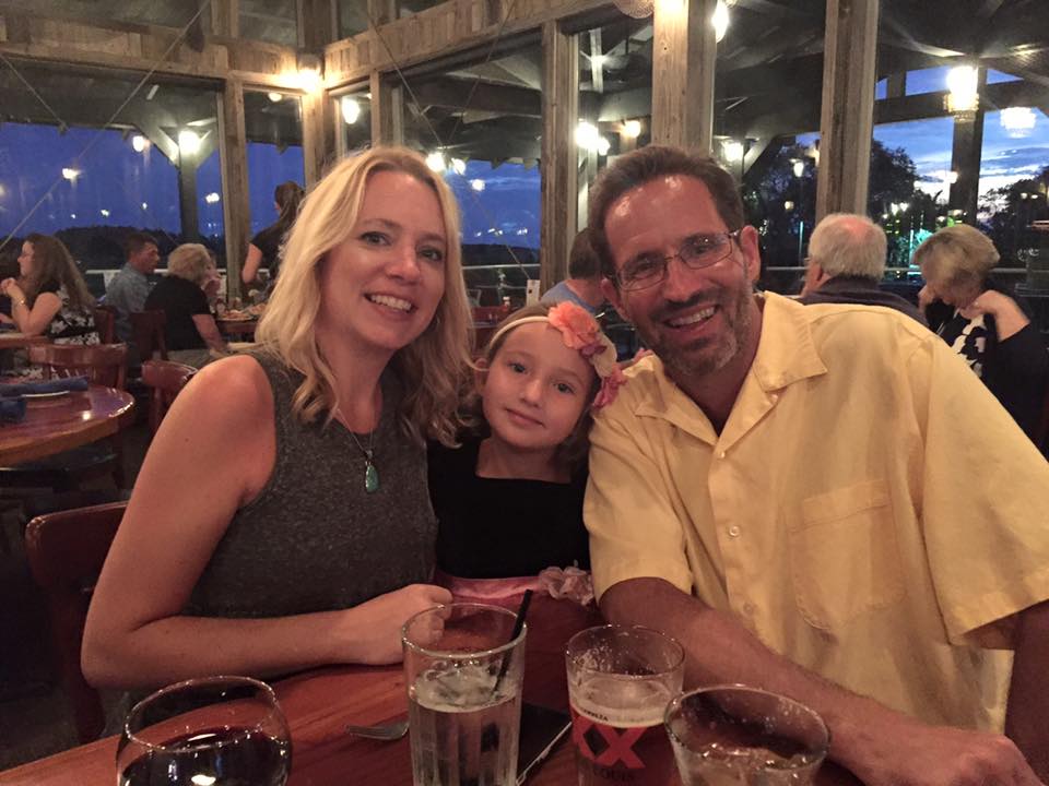 Holly with family at restaurant