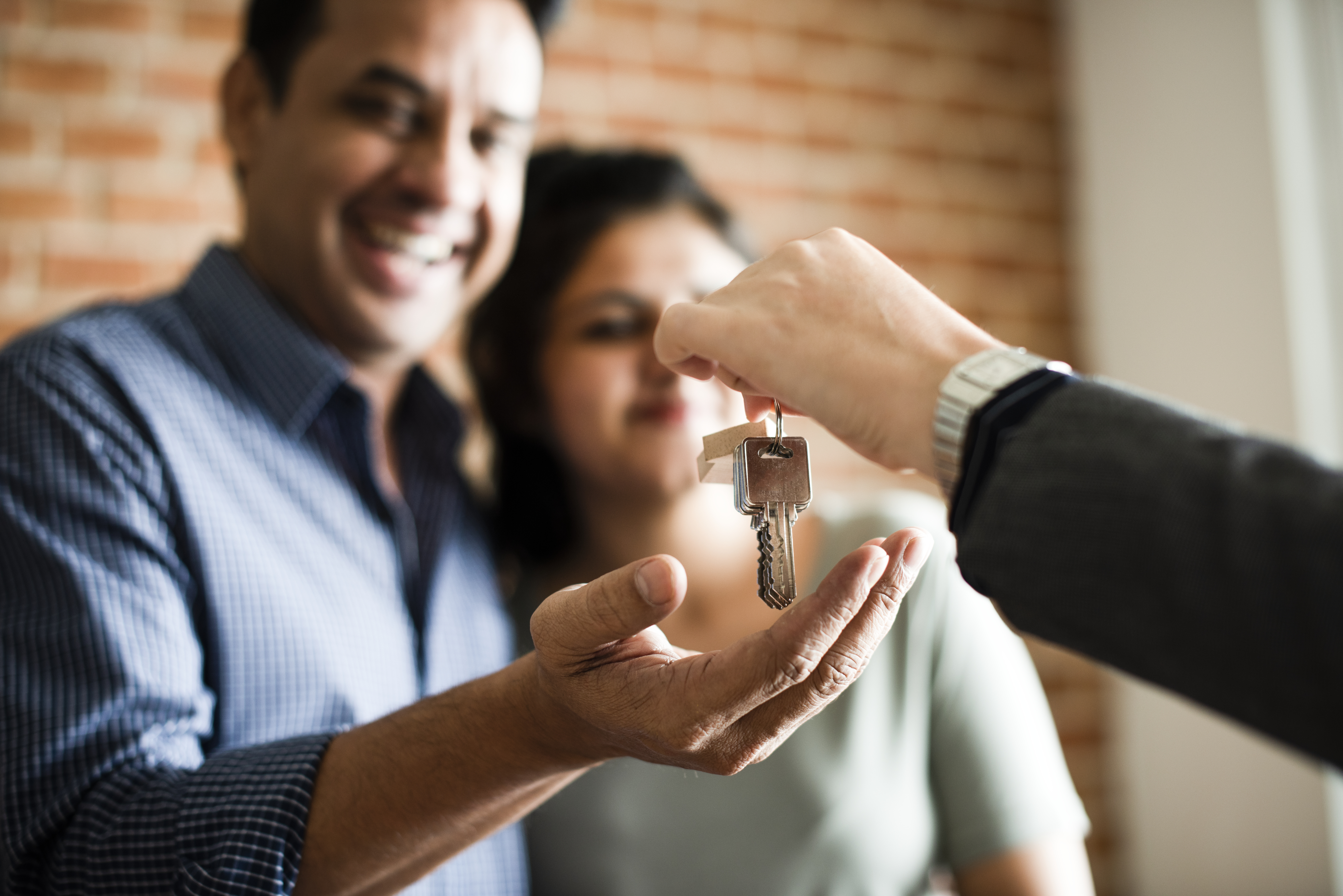 Real Estate Agent Giving Buyer House keys
