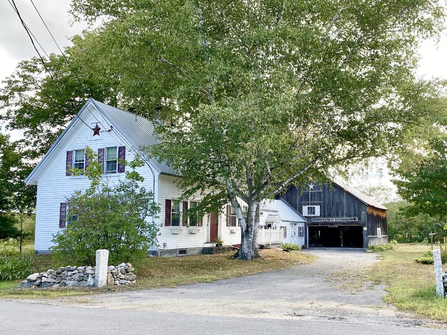 Two story farmhouse with detached barn