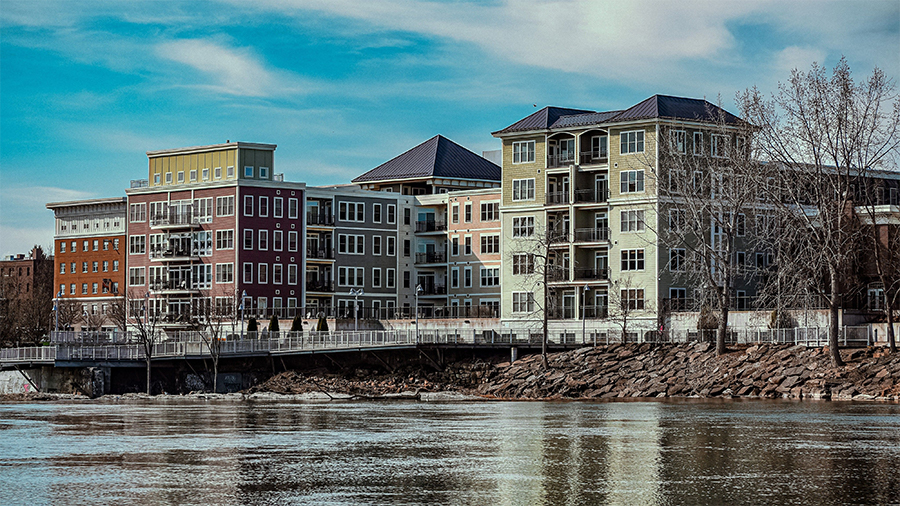 featured complex building with parking lot