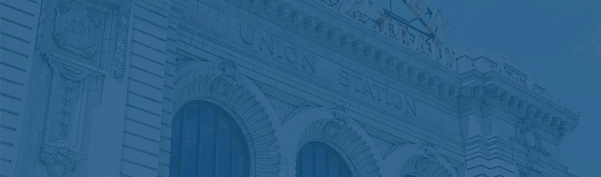 background image of building with blue overlay
