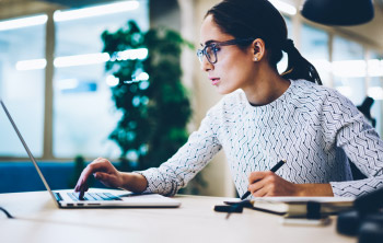 woman staring out of window