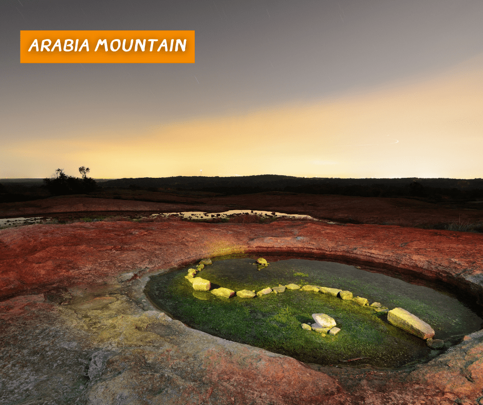Views of a crater filled with water at the top of Arabia mountain