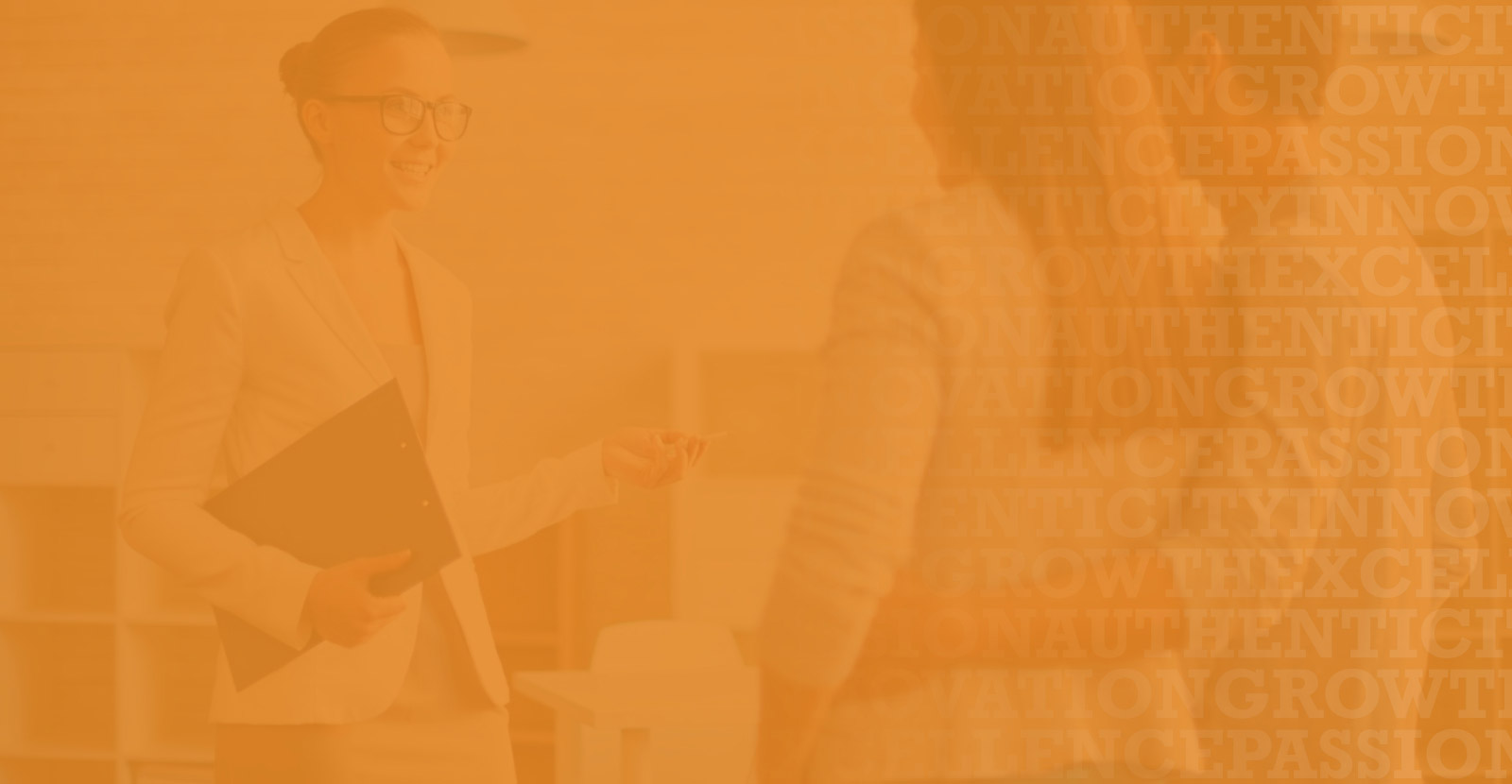 two women and a man in a formal attire laughing together