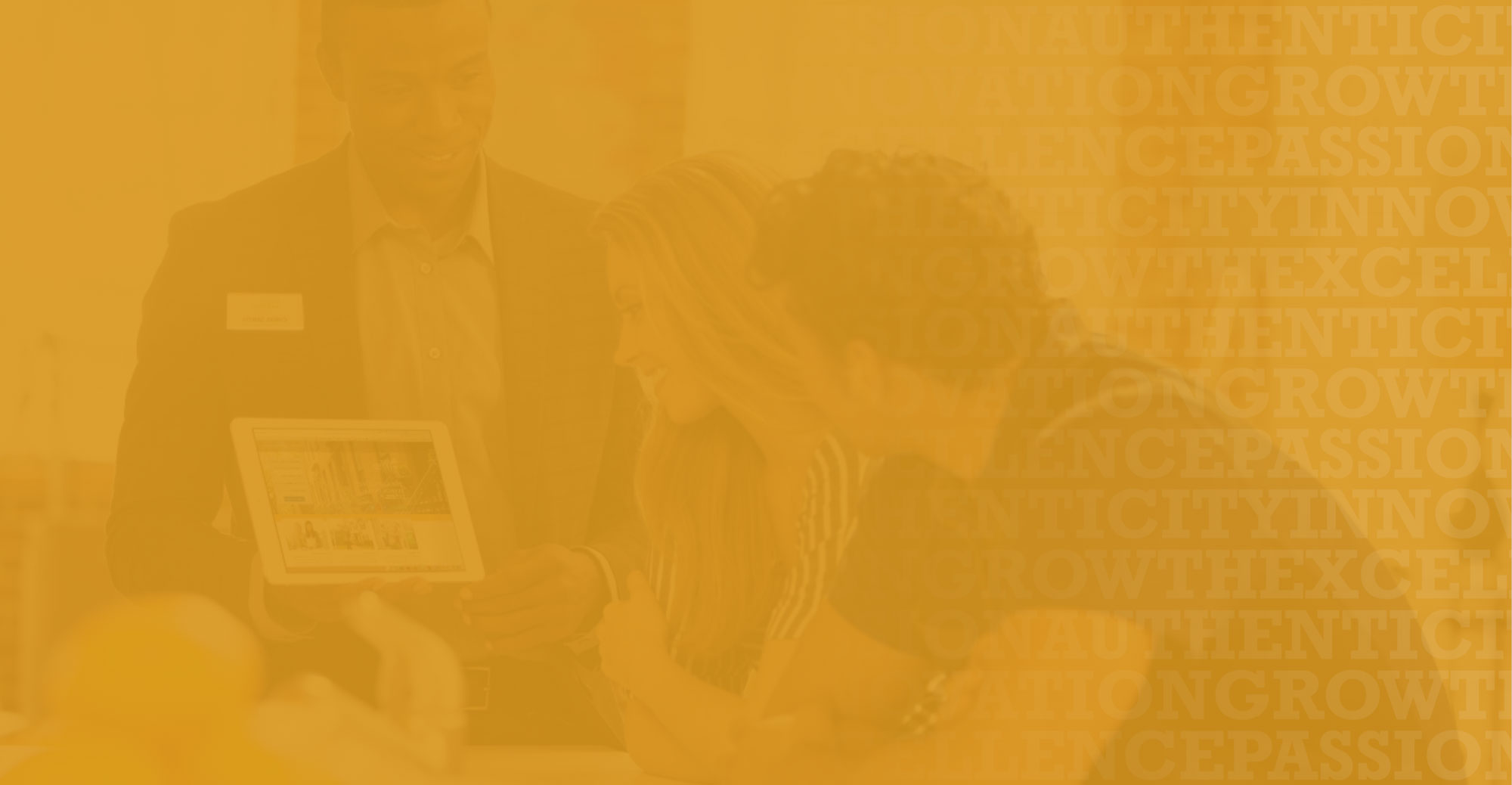 two women and a man in a formal attire laughing together