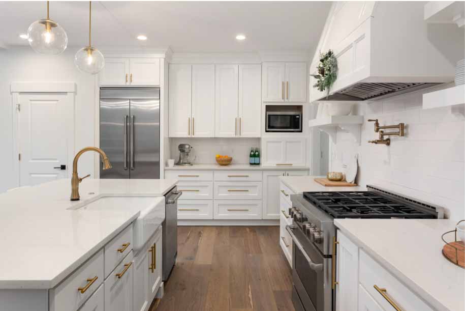 White Kitchen with gold faucet