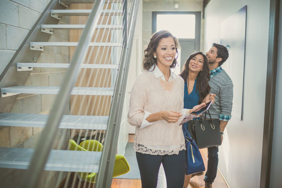 Couple Looking at a House with an Agent