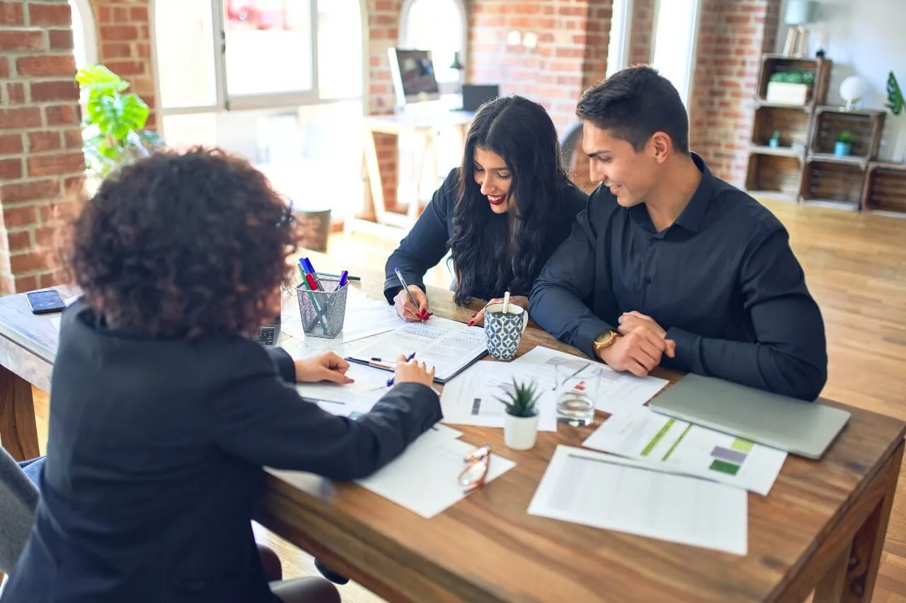 Young beautiful couple applying for mortgage