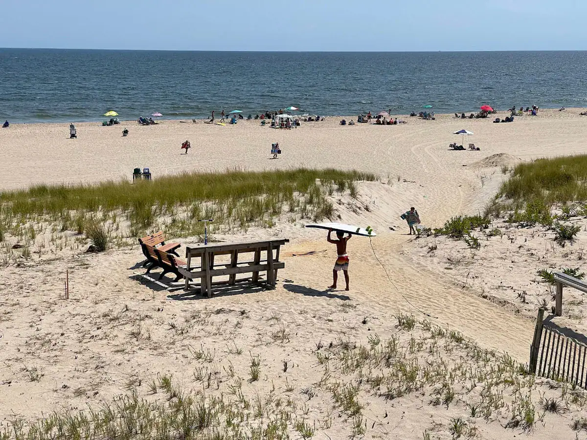 People and a surfer enjoying a beach day on Long Beach Island