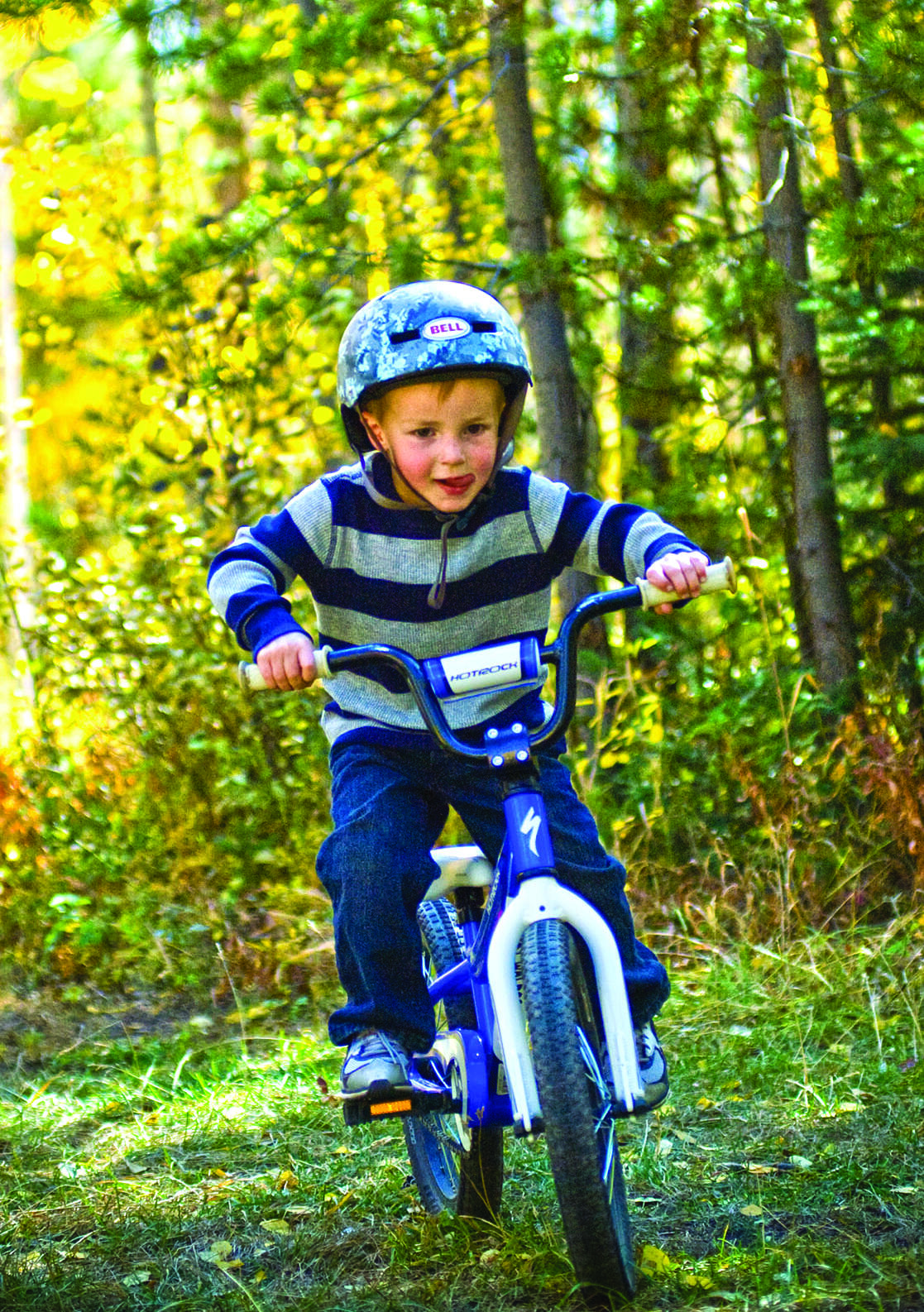 Cycling, mountain biker couple on cycle trail in autumn forest. Mountain biking in autumn landscape forest. Man and woman cycling MTB flow uphill trail.