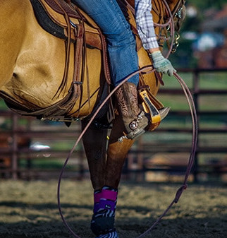 someone is horseback riding