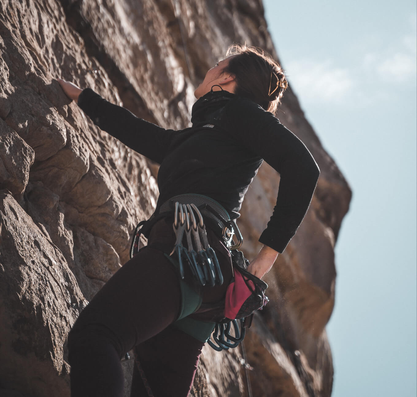 the girl is climbing a peak
