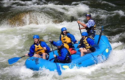 people are whitewater rafting