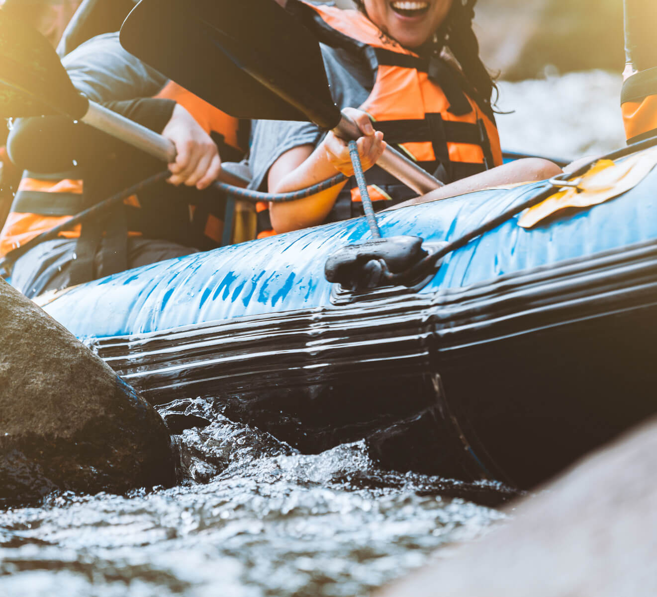 people are whitewater rafting