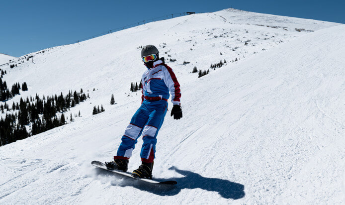 someone is snowboarding