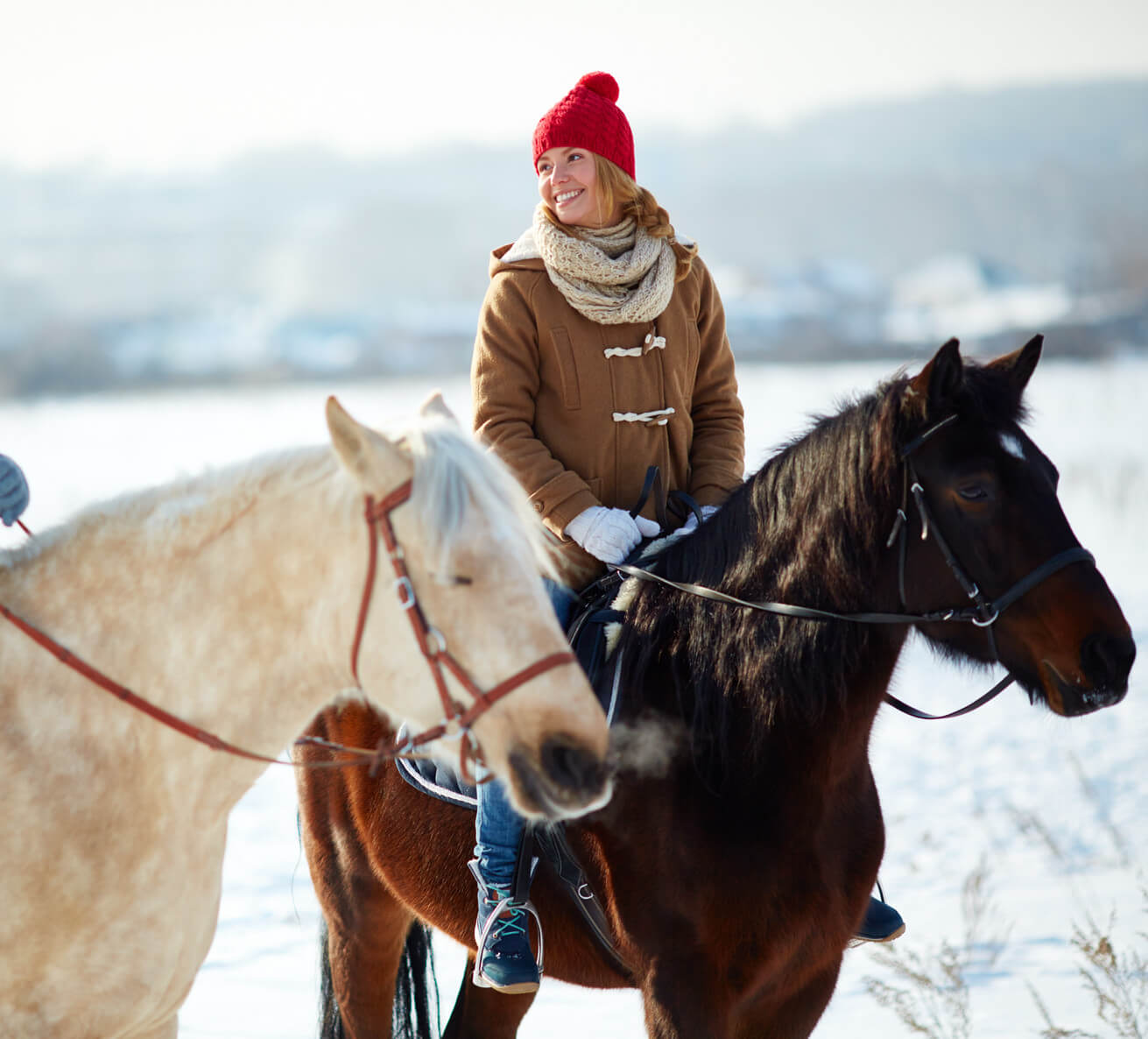 the girl is horseback riding 