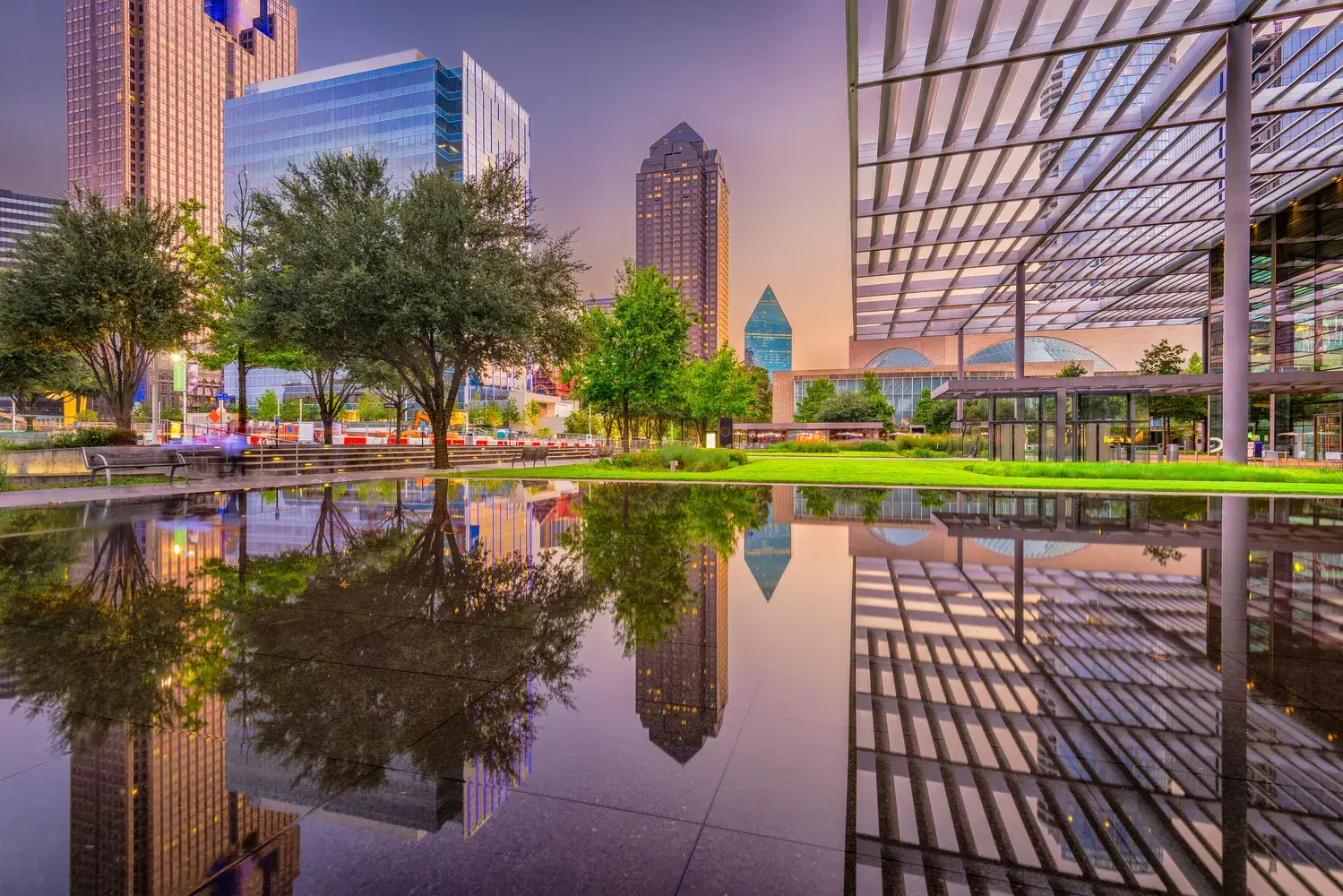Dallas, Texas, USA downtown plaza and cityscape at twilight.