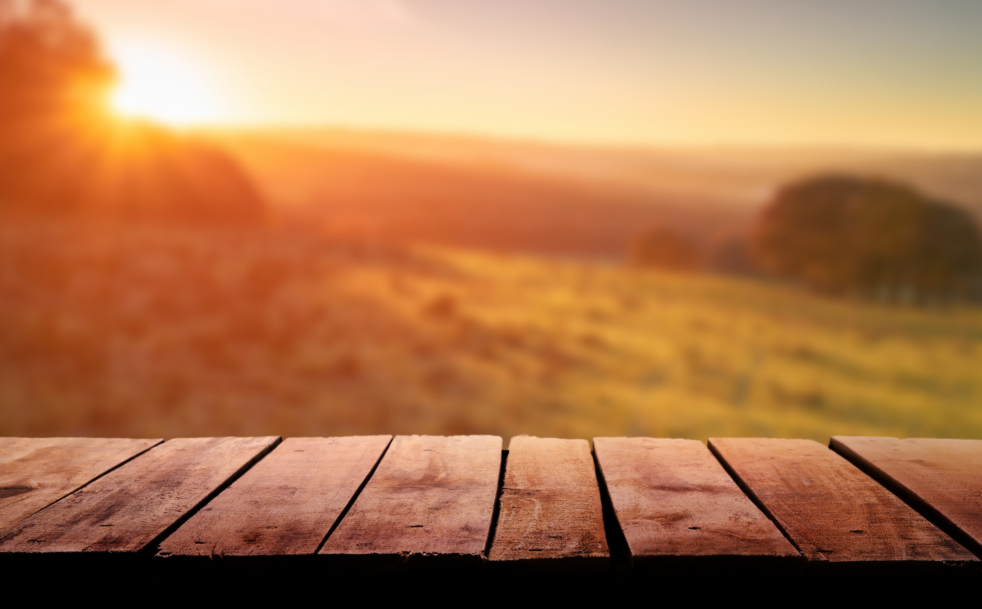 wooden table with sunset