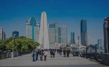 city boardwalk with people and buildings in background