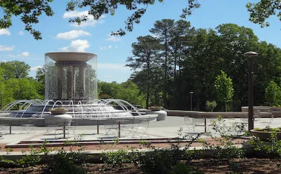 large fountain on sunny day with people