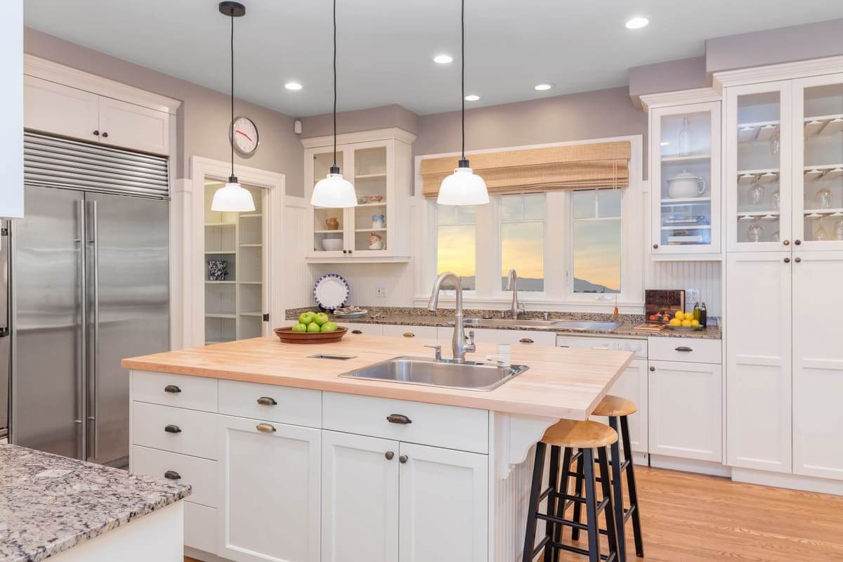 Amazing Luxury Kitchen Interior in white with wooden floor and kitchen island