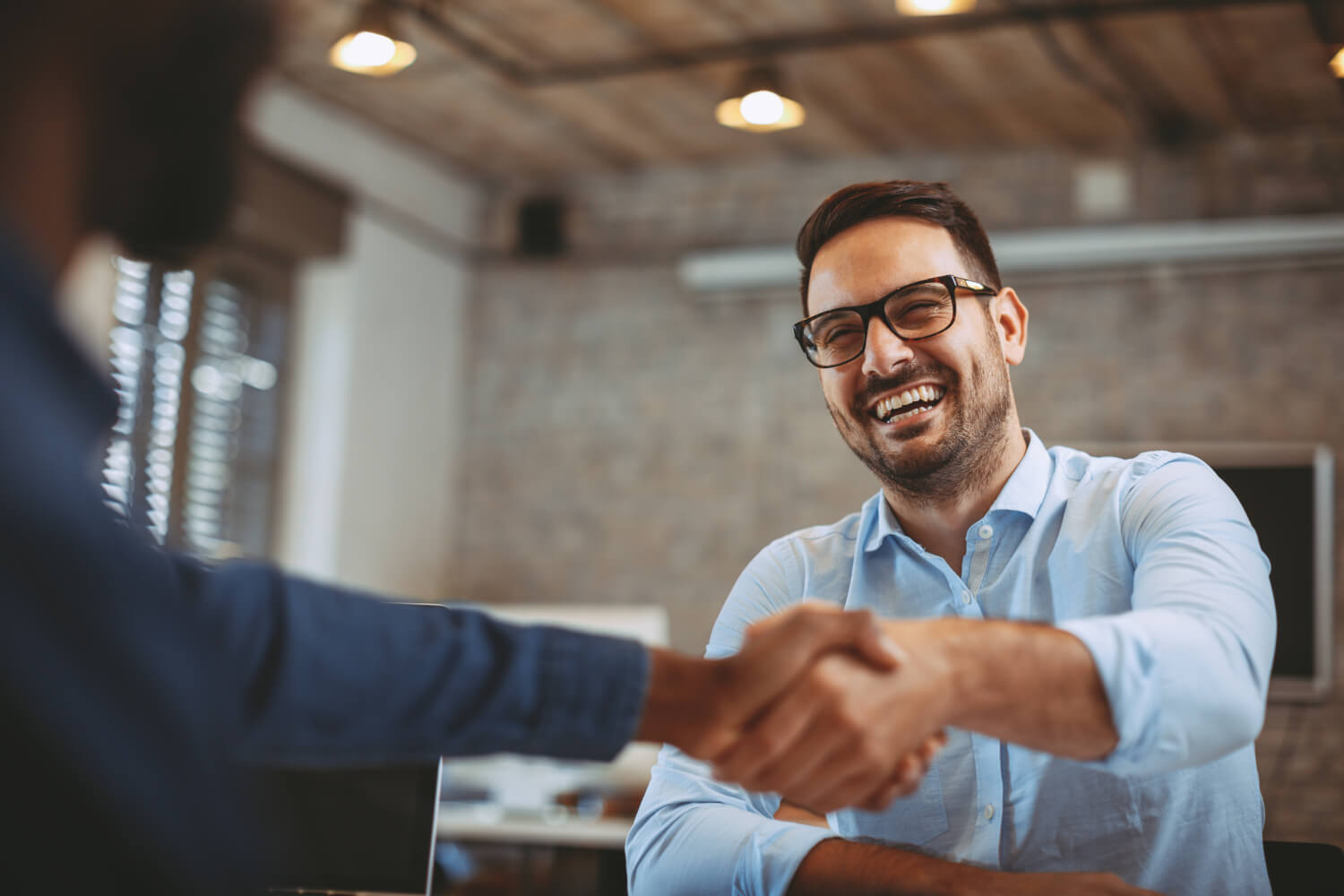 Close up of handshake in the office