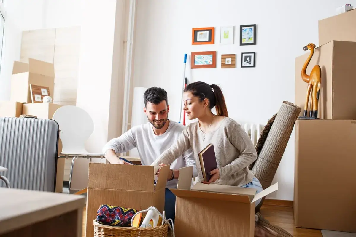 Happy Couple Unpacking Boxes