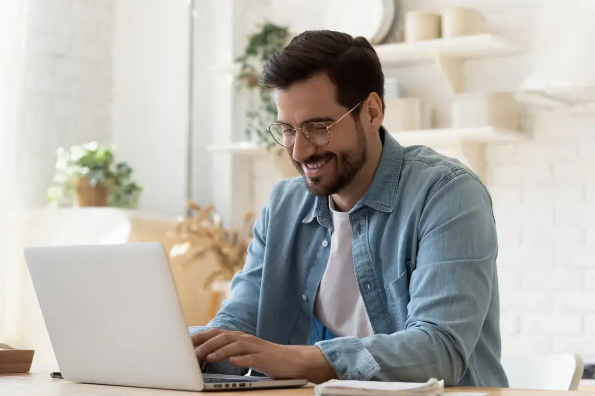 Man is working on the laptop