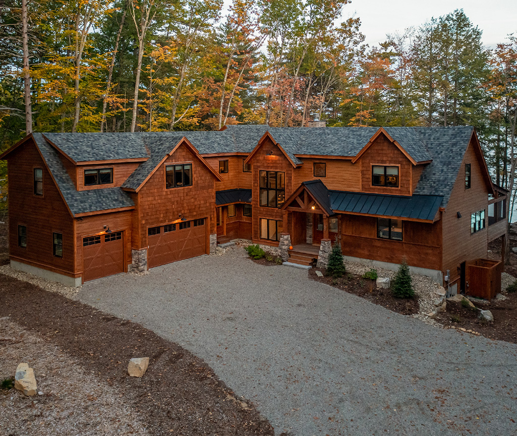 House in woods next to lake