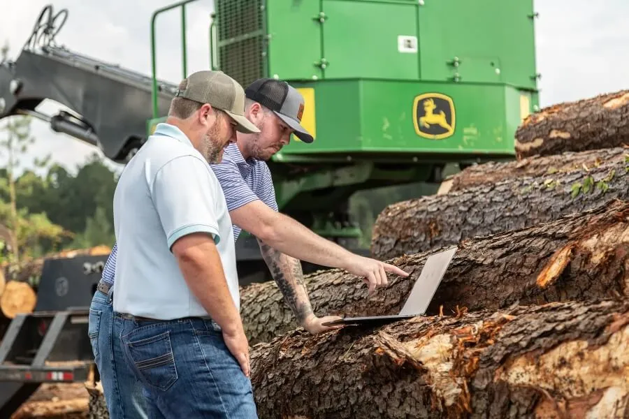 Justin And Bruce Leaning Against Timber